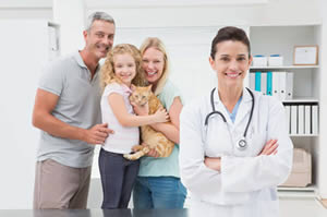 Family with pet and vet image